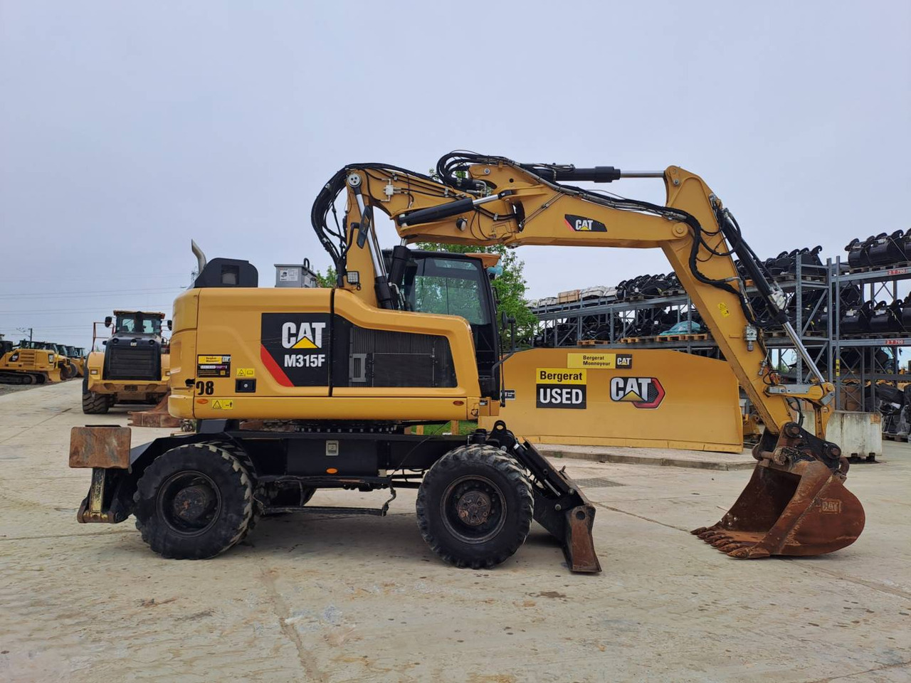 CAT M315F IVC - Bager na kolesih: slika 1 CAT M315F IVC - Bager na kolesih: slika 1