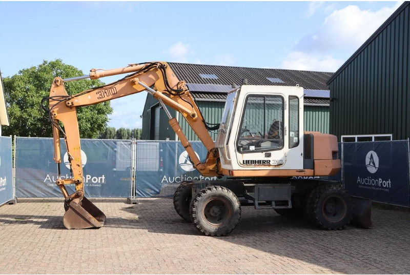 Liebherr A 310 - Bager na kolesih: slika 1 Liebherr A 310 - Bager na kolesih: slika 1